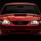 Raxiom 99-04 Ford Mustang Axial Series Headlights w/ LED Bar- Black Housing (Clear Lens)