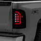 Raxiom 07-14 Chevrolet Silverado 1500 Axial Series LED Tail Lights- Black Housing (Smoked Lens)