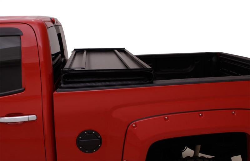 Lund 04-15 Nissan Titan (5.5ft. Bed) Hard Fold Tonneau Cover w/Bracket Kit - Black