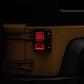Raxiom 07-18 Jeep Wrangler JK Axial Series Lux LED Tail Lights- Black Housing (Clear Lens)